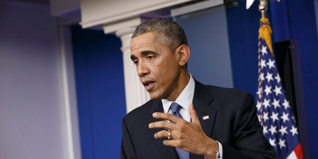 President Barack Obama speaks during a news conference in the Brady Press Briefing Room of the White House in Washington, Friday, Dec. 19, 2014. The president claimed an array of successes in 2014, citing lower unemployment, a rising number of Americans covered by health insurance, and an historic diplomatic opening with Cuba. He also touts his own executive action and a Chinese agreement to combat global warming. (AP Photo/J. Scott Applewhite)