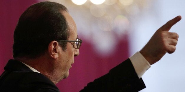 French President Francois Hollande delivers a speech during a New Year ceremony for business and employment sector representa