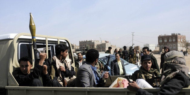SANAA, YEMEN - JANUARY 19: Armed members of Houthis gather at Sebin Square as they close the Sebin Road to traffic near presi