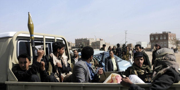 SANAA, YEMEN - JANUARY 19: Armed members of Houthis gather at Sebin Square as they close the Sebin Road to traffic near presidential palace following the conflicts between palace guards and Houthis in Sanaa, Yemen on January 19, 2015. (Photo by Mohammed Hamoud/Anadolu Agency/Getty Images)