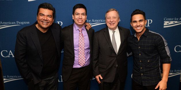 UNITED STATES - JANUARY 13: From left, actor George Lopez, who stars in Spare Parts, Oscar Vazquez, a student from the school who is portrayed by Carlos PenaVega, right, and, Senate Minority Whip Richard Durbin, D-Ill., talk after a screening of the film at the E Street Cinema, January 13, 2015. It is the story of hispanic high school students who prevail in a science competition, despite long odds, against well established universities. The screening was part of the Center for American Progress' Reel Progress film series and Durbin was in attendance because of his sponsorship of the Dream Act. (Photo By Tom Williams/CQ Roll Call)