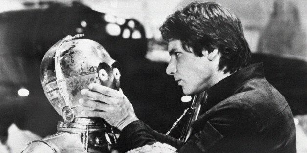 Actor Harrison Ford uses primitive means to deactivate robot C-3POâs voice mechanism May 31, 1980 during a scene from the âStar Warsâ movie sequel, âThe Empire Strikes Back.â On screen, Ford is best known as wise-cracking Han Solo. Off screen, Ford isnât so cocky. (AP Photo)