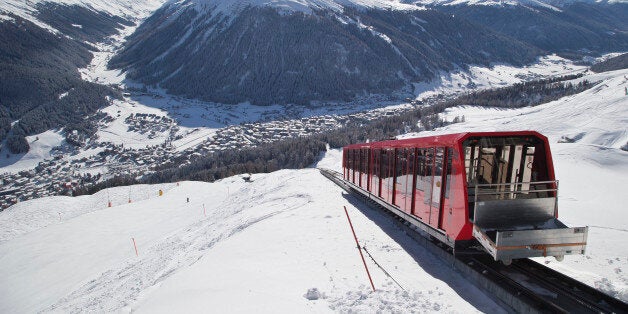 A cable train makes its way up the Weissfluhjoch mountain in Davos, Switzerland, Monday, Jan. 19, 2015. The world's financia