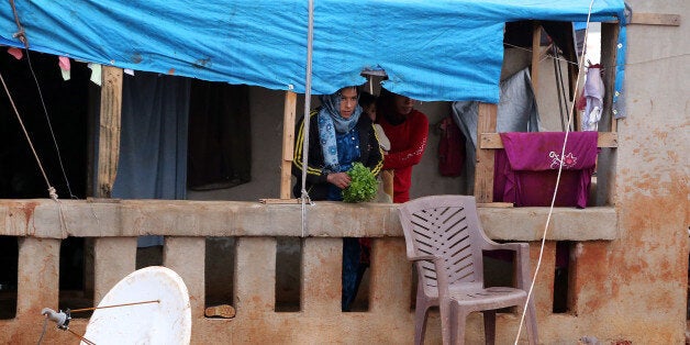 IDLIB, SYRIA - JANUARY 12: Thousands of Syrian refugees, fled their homes due to the attacks of Assad's forces, try to hold