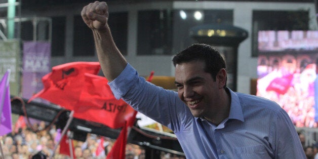 ATHENS, GREECE - MAY 22: Before the European Parliament election, Syriza party leader Alexis Tsipras speaks to crowd during his party's main election rally at Omonia square in Athens, Greece on May 22, 2014. (Photo by Ayhan Mehmet/Anadolu Agency/Getty Images)