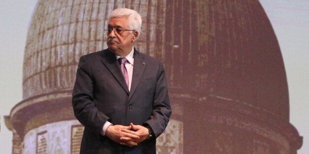 Palestinian President Mahmud Abbas waits to speak in the West Bank city of Ramallah on January 4, 2015. Abbas spoke about the steps he took to try and get membership for Palestinians to the International Criminal Court, in a move strongly condemned by both Washington and Israel. AFP PHOTO/ ABBAS MOMANI (Photo credit should read ABBAS MOMANI/AFP/Getty Images)