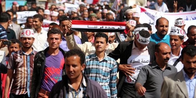 IBB, YEMEN - JANUARY 24: Yemenis gather at Ibb University shout slogans and hold banners during a protest against Houthis in Ibb, Yemen on January 24, 2015. (Photo by Adel es-Sharee/Anadolu Agency/Getty Images)