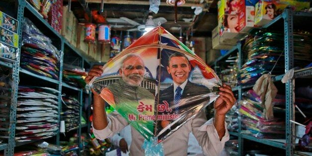 An Indian shopkeeper displays a kite with portraits of India's Prime Minister Narendra Modi and U.S. President Barack Obama at a shop in Mumbai, India, Friday, Jan. 23, 2015. Obama arrives in New Delhi on Sunday and will be the first American president to attend Indiaâs annual Republic Day festivities marked annually on Jan. 26. (AP Photo/Rafiq Maqbool)