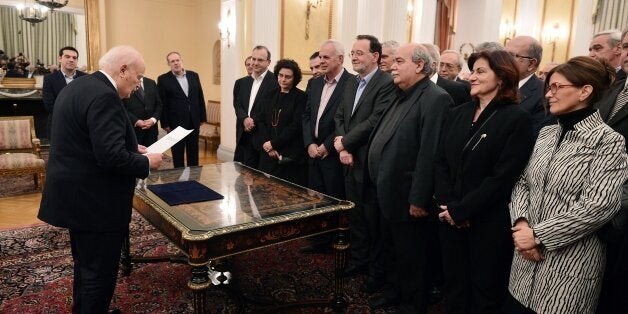 The newly formed government of the Prime Minister Alexis Tsipras take the civil oath in the presence of the Greek President Karolos Papoulias, at the presidental palace in Athens, on January 27, 2015. Greece named radical left-wing economist Yanis Varoufakis its new finance minister giving him the mammoth task of leading negotiations with international creditors over the country's bailout. AFP PHOTO / LOUISA GOULIAMAKI (Photo credit should read LOUISA GOULIAMAKI/AFP/Getty Images)