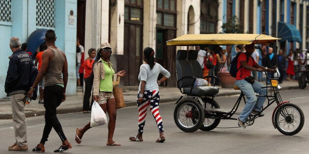 HAVANA, CUBA - JANUARY 26: The United States flag is appearing in small ways in the clothing worn by Cubans, like the tights worn by this woman in the Vedado district January 26, 2015 in Havana, Cuba. As diplomats work to reestablish diplomatic ties between Cuba and the United States, Cubans face a new reality that could mean less restricted travel between the former Cold War enemies and easier access to telecommunications technology, building materials and American food products. (Photo by Chip Somodevilla/Getty Images)