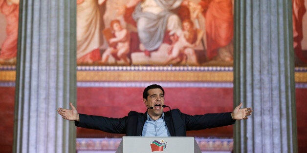 Leader of Syriza left-wing party Alexis Tsipras speaks to his supporters outside Athens University Headquarters, Sunday, Jan. 25, 2015. Anti-bailout Syriza, led by the 40-year-old Alexis Tsipras, won Sunday's snap general election, but it was unclear whether he would have enough seats in parliament to form a government alone, or whether he would need the support of a smaller party. (AP Photo/Petros Giannakouris)