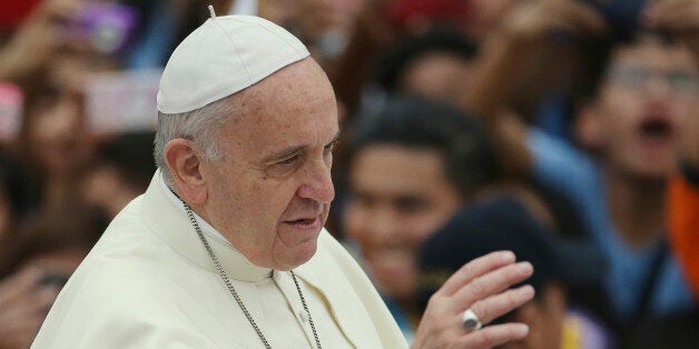 Pope Francis waves during the "Meeting with Families" at the University of Santo Tomas in Manila, Philippines on Sunday, Jan. 18, 2015. (AP Photo/Aaron Favila)