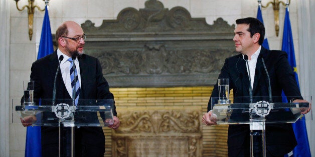 Greek Prime Minister Alexis Tsipras, right, and European Parliament President Martin Schulz hold a news conference after their meeting at Maximos Mansion in Athens, Thursday, Jan. 29, 2015. Schulz is the first European Union official to meet Tsipras, whose new Cabinet alarmed the Greek stock market Wednesday with promises to renege on a series of key budget commitments made by previous administrations in exchange for 240 billion euros in rescue loans. (AP Photo/Lefteris Pitarakis)