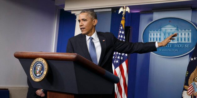 President Barack Obama speaks during a news conference in the Brady Press Briefing Room of the White House in Washington, Friday, Dec. 19, 2014. The president claimed an array of successes in 2014, citing lower unemployment, a rising number of Americans covered by health insurance, and an historic diplomatic opening with Cuba. He also touts his own executive action and a Chinese agreement to combat global warming. (AP Photo/J. Scott Applewhite)