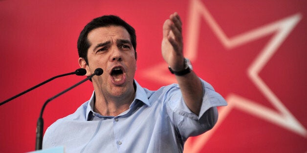 Leftist party Syriza leader, Alexis Tsipras addresses supporters on June 17, 2013 on the central Syntagma Square in Athens during a rally to demand early elections. Prime Minister Antonis Samaras held an emergency meeting with his coalition allies on June 17 as a furore over the shock shutdown of state broadcaster ERT threatened to bring down the government. Greece's top administrative court on June 17 'temporarily' cancelled the government's shock decision to close state broadcaster ERT, ordering its reopening until a new national media body can be set up. AFP PHOTO / LOUISA GOULIAMAKI (Photo credit should read LOUISA GOULIAMAKI/AFP/Getty Images)