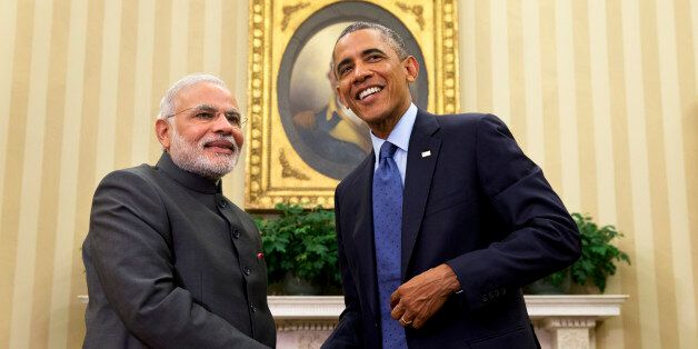 President Barack Obama shakes hands with Indian Prime Minister Narendra Modi, Tuesday, Sept. 30, 2014, in the Oval Office Â of the White House in Washington. President Barack Obama and India's new Prime Minister Narendra Modi said Tuesday that "it is time to set a new agenda" between their countries, addressing concerns that the world's two largest democracies have grown apart. (AP Photo/Evan Vucci)