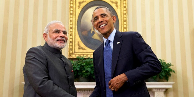 President Barack Obama shakes hands with Indian Prime Minister Narendra Modi, Tuesday, Sept. 30, 2014, in the Oval Office  of the White House in Washington. President Barack Obama and India's new Prime Minister Narendra Modi said Tuesday that "it is time to set a new agenda" between their countries, addressing concerns that the world's two largest democracies have grown apart. (AP Photo/Evan Vucci)