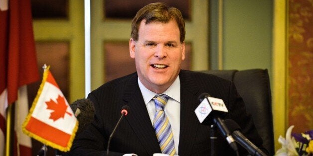 Canada's Foreign Minister John Baird speaks during a press conference with his Egyptian counterpart Sameh Shoukry in Cairo on January 15, 2015, after their meeting to discuss bilateral relations and the release of Canadian journalist Mohamed Fahmy imprisoned with two Al-Jazeera colleagues in Egypt. Baird played down expectations that his visit could see Canadian-Egyptian Fahmy freed imminently after more than a year in jail. AFP PHOTO / MOHAMED EL-SHAHED (Photo credit should read MOHAMED EL-SHAHED/AFP/Getty Images)