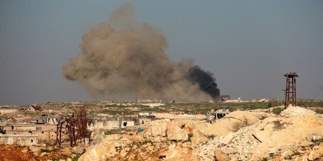 ALEPPO, SYRIA - FEBRUARY 03: Smoke rises during an ongoing fight against Syrian Regime Forces in Tal Mayyasat town of Aleppo, Syria on February 03, 2015. Al-Sham Front, backed by Ansaruddin factions, seized control of the strategic town of Tal Mayyasat and killed 30 regime soldiers in northeastern Aleppo, opposition forces reported. (Salih Mahmud Leyla - Anadolu Agency)