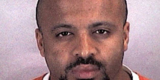 FILE - In this undated file photo provided by the Sherburne County Sheriff Office, Zacarias Moussaoui is shown. Moussaoui, known as the "20th hijacker" in the 9/11 terror attacks is asking a South Florida federal judge for a transfer to the military prison at Guantanamo Bay, Cuba. The request is part of a rambling, handwritten letter filed Wednesday, Dec. 10, 2014, in Miami federal court. He is serving a life prison sentence after pleading guilty in 2005 to conspiring with the Sept. 11 hijackers to kill Americans. Moussaoui has been writing letters to courts around the country from his prison cell in Florence, Colorado, claiming inside knowledge about al-Qaida and the Sept. 11, 2001, plot. The letter filed in Miami repeats some of those claims. (AP Photo/Sherburne County, Minn., Sheriff's Office, File)