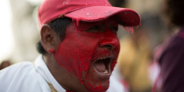 MEXICO CITY, MEXICO - JANUARY 26: Demonstrators and relatives of the 43 missing students from Ayotzinapa take part in a glob