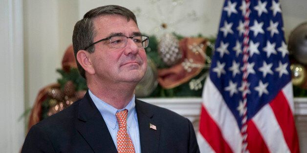 Ashton Carter, former deputy secretary of defense and U.S. President Barack Obama's nominee to be U.S. secretary of defense, listens as U.S. President Barack Obama, not pictured, speaks in the Roosevelt Room of the White House in Washington, D.C., U.S., on Friday, Dec. 5, 2014. Carter, 60, spent more than two years as the Defense Department's No. 2 civilian leader under former Secretary Leon Panetta and then Chuck Hagel, the current defense secretary. He also served under Obama's first Pentagon chief, Robert Gates, as the military's top weapons buyer. Photographer: Andrew Harrer/Bloomberg via Getty Images 