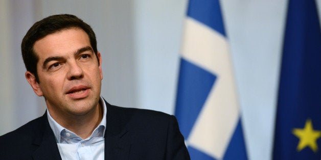 PARIS, FRANCE - FEBRUARY 04: Greece's Prime Minister Alexis Tsipras delivers a speech with French President at Elysee Palace after their meeting to discuss the Eurozone on February 4, 2015 in Paris, France. (Photo by Frederic Stevens/Getty Images)