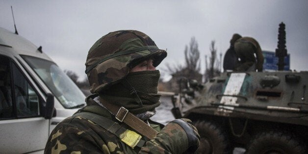 Ukrainian army soldiers resupply their battalion at the gate of Debaltseve, in the Donetsk region, on February 3, 2015. At le