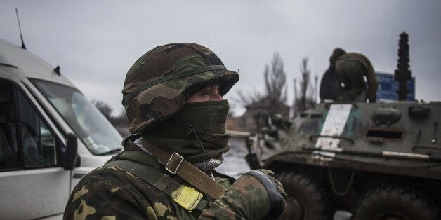 Ukrainian army soldiers resupply their battalion at the gate of Debaltseve, in the Donetsk region, on February 3, 2015. At least 19 civilians and five government troops were killed over the previous 24 hours as fierce clashes raged between pro-Russian separatists and Ukraine's outgunned forces in the east of the country, insurgent and government officials said. AFP PHOTO / MANU BRABO (Photo credit should read MANU BRABO/AFP/Getty Images)