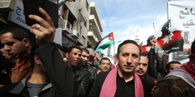 AMMAN, JORDAN - FEBRUARY 06: Jordanian parliament member Motaz Abu Rumman (R) attends a protest staged against the killing of