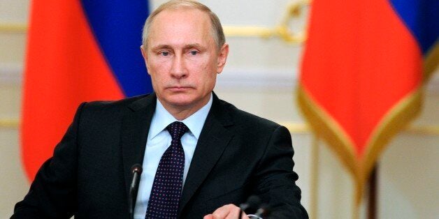 Russian President Vladimir Putin heads a cabinet meeting in the Novo-Ogaryovo residence, outside Moscow, Russia, Wednesday, F