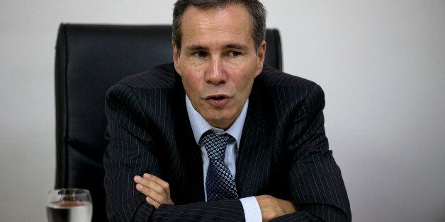 In this May 29, 2013 photo, Alberto Nisman, the prosecutor investigating the 1994 bombing of the Argentine-Israeli Mutual Association community center, talks to journalists in Buenos Aires, Argentina. Nisman who accused the government of secret deals with Iran over the investigation was found shot dead at his apartment early Monday Jan. 19, 2014. He was due to participate in a closed-door session with Congress Monday over his claim last week that de Kirchner and Foreign Minister Hector Timerman covered up a deal with Iran. (AP Photo/Natacha Pisarenko)