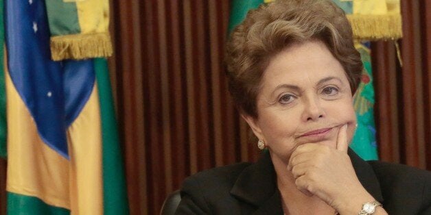 Brazil's President Dilma Rousseff participates in the 16th meeting of the National Council for Industrial Development (CNDI), at Planalto Palace in Brasilia on February 09, 2015. AFP PHOTO / Wenderson Araujo (Photo credit should read WENDERSON ARAUJO/AFP/Getty Images)