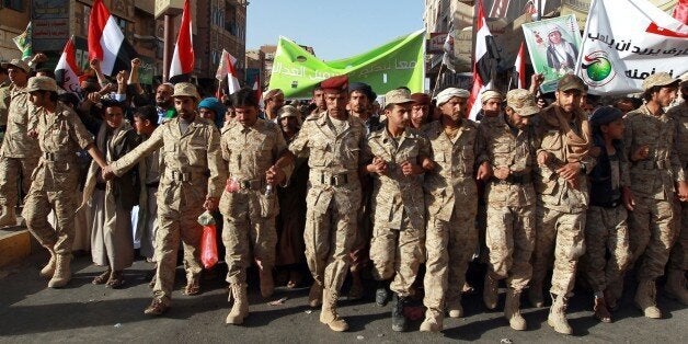 Yemeni supporters of the Shiite Huthi movement take part in a rally to commemorate the fourth anniversary of the start of the uprising that forced out president Ali Abdullah Saleh in Sanaa on February 11, 2015. Following their takeover in the capital, the Huthi militia seized more territory in the Sunni-majority country this week, sparking fears of a backlash from its feared Al-Qaeda branch. AFP PHOTO / MOHAMMED HUWAIS (Photo credit should read MOHAMMED HUWAIS/AFP/Getty Images)