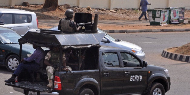 Nigerian troops patrol with a vehicle in the city of Abuja, Nigeria, Saturday, Feb. 7, 2015. Nigeria is postponing presidenti