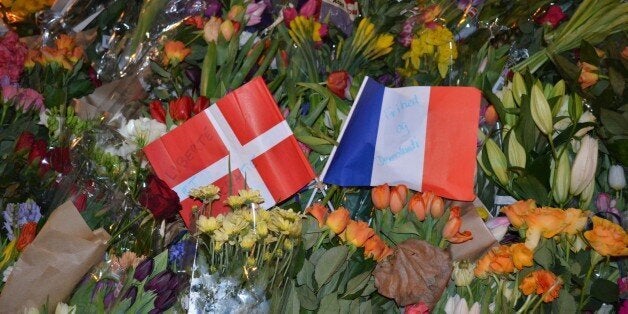 COPENHAGEN, DENMARK - FEBRUARY 15: Citizens of Copenhagen lay down flowers at the scene of a terrorist attack near the Krudtoenden cultural center in Copenhagen, Denmark, on February 15, 2015. (Photo by Recep Yasar /Anadolu Agency/Getty Images)