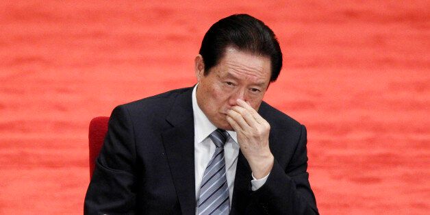 FILE - In this file photo taken May 4, 2012, Zhou Yongkang, Chinese Communist Party Politburo Standing Committee member in charge of security, attends a conference to celebrate the 90th anniversary of the founding of Chinese Communist Youth League at the Great Hall of the People in Beijing. The fate of the once-feared Zhou, 72, appeared to be sealed by the just-after-midnight announcements Saturday that he was expelled from China's ruling Communist Party and arrested in a criminal investigation into allegations ranging from bribe-taking to leaking state secrets. (AP Photo/Alexander F. Yuan, File)