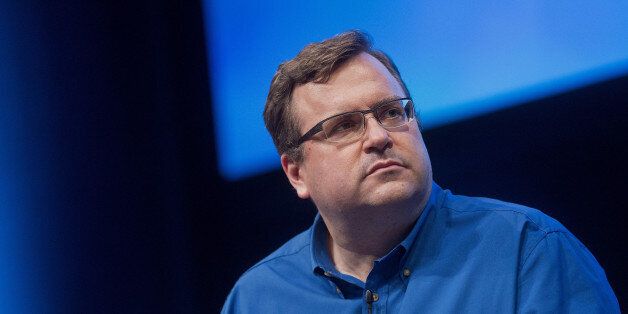 Reid Hoffman, chairman and co-founder of LinkedIn Corp., listens during a panel discussion at the DreamForce Conference in San Francisco, California, U.S., on Monday, Oct. 13, 2014. Salesforce.com Inc. is entering a new business, data analytics and business intelligence, seeking to maintain growth and persuade customers to pour more of their information into its data centers. Photographer: Noah Berger/Bloomberg via Getty Images 