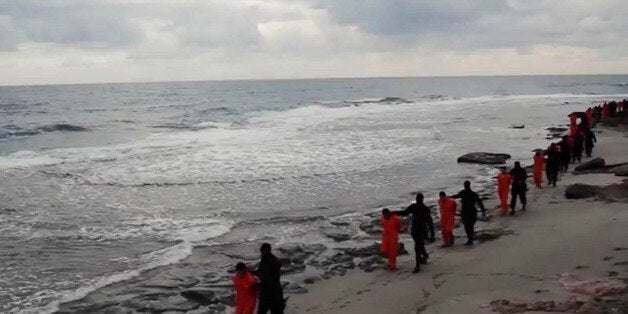 FILE - In this file image made from a video released Sunday, Feb. 15, 2015 by militants in Libya claiming loyalty to the Isla