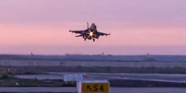 In this video image released by the Egyptian Defense Ministry, an Egyptian fighter jet lands in Egypt, Monday, Feb. 16, 2015.