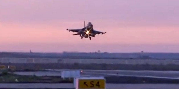 In this video image released by the Egyptian Defense Ministry, an Egyptian fighter jet lands in Egypt, Monday, Feb. 16, 2015. Egyptian warplanes struck Islamic State targets in Libya in swift retribution for the extremists' beheading of a group of Egyptian Christian hostages on a beach, shown in a grisly online video released hours earlier. (AP Photo/Egyptian Defense Ministry)