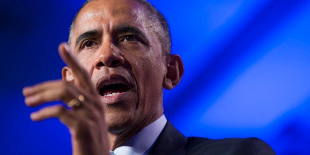 President Barack Obama speaks at the Democratic National Committee winter meeting in Washington, Friday, Feb. 20, 2015. Taunting Republicans, the president said it's "not an accident" that the economy is improving on his watch and that Republicans' "doom and gloom" predictions haven't come true. (AP Photo/Evan Vucci)