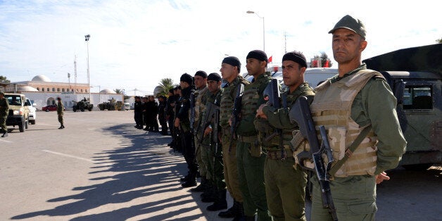 MEDENINE, TUNISIA - DECEMBER 07: Tunisian security forces take security measures near Raj Jedir border crossing on the Tunisian-Libyan border after an air strike hit a Libyan militia post on the border with Tunisia on December 05, in Medenine, Tunisia on December 07, 2014. (Photo by Tasnim Nasri/Anadolu Agency/Getty Images)