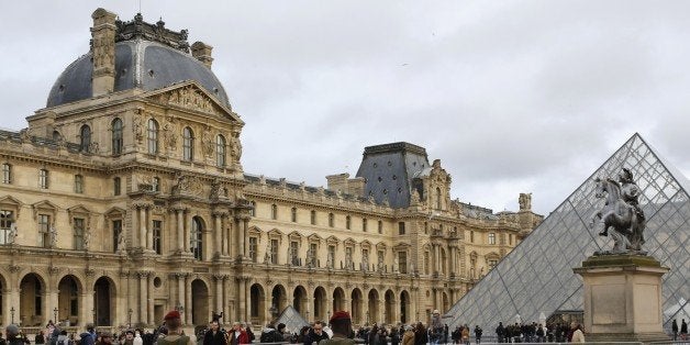 FILE - In this a Jan.10 2015 file photo, of French soldiers as theypatrol near the Louvre Museum in Paris. Fearing that actors could be mistaken for police and chase scenes confused for the real thing Paris is sharply restricting filming of action movies in the city that been the stage for some of filmâs most memorable high-octane sequences. Filming outside scenes with police, army or security services was quietly banned after the attacks in the French capital that left 20 dead, including three gunmen. (AP Photo/Laurent Cipriani, File)