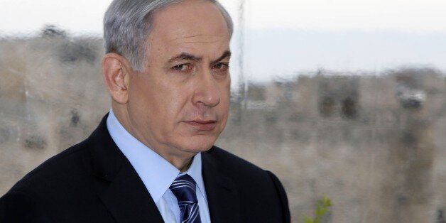 Backdropped by Jerusalem's Old City Ottoman walls, Israeli Prime Minister Benjamin Netanyahu looks on during a joint press conference with Jerusalem's mayor Nir Barkat (unseen) on February 23, 2015, a day after Barkat and his bodyguard apprehended a young Palestinian who stabbed an ultra-Orthodox Jew in Jerusalem. AFP PHOTO / GALI TIBBON (Photo credit should read GALI TIBBON/AFP/Getty Images)