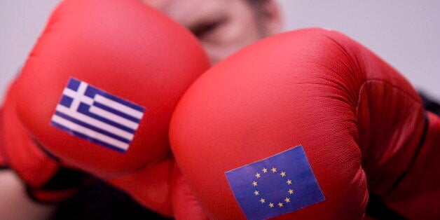 GERMANY, BONN - FEBRUARY 20:Â Boxer and boxing gloves with the flags of Greece and the EU, on February 20, 2015 in Bonn, Germ