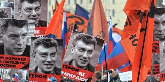 MOSCOW, RUSSIA - MARCH 1: People march in memory of Russian opposition leader and former Deputy Prime Minister Boris Nemtsov on March 01, 2015 in central Moscow, Russia. Nemtsov was murdered on Bolshoi Moskvoretsky bridge near St. Basil cathedral just a few steps from the Kremlin on February 27. (Photo by Pyotr Kassin/Kommersant Photo via Getty Images)