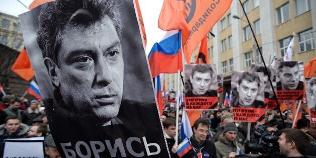 MOSCOW, RUSSIA - MARCH 1: People march in memory of Russian opposition leader and former Deputy Prime Minister Boris Nemtsov on March 01, 2015 in central Moscow, Russia. Nemtsov was murdered on Bolshoi Moskvoretsky bridge near St. Basil cathedral just a few steps from the Kremlin on February 27. (Photo by Sergey Bobylev/Kommersant Photo via Getty Images)