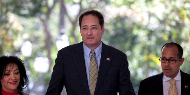 U.S. ChargÃ© d'Affaires Lee McClenny, center, arrives for a private meeting with Venezuela's Foreign Relations Minister Delcy Rodriguez in Caracas, Venezuela, Monday, March 2, 2015. President Nicolas Maduro announced over the weekend that the government had detained American spies and would be taking steps to shrink the U.S Embassy staff. (AP Photo/Ariana Cubillos)