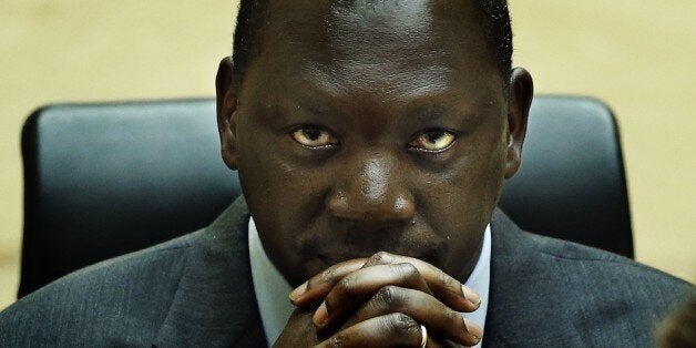 Congolese warlord Thomas Lubanga hears the first-ever sentence delivered by The International Criminal Court (ICC) in the Hague, on July 10, 2012. Lubanga, 51, was sentenced to 14 years in jail for using child soldiers in his rebel army, in the tribunal's first such order. AFP PHOTO/ANP /JERRY LAMPEN POOL/ netherlands out (Photo credit should read JERRY LAMPEN/AFP/GettyImages)